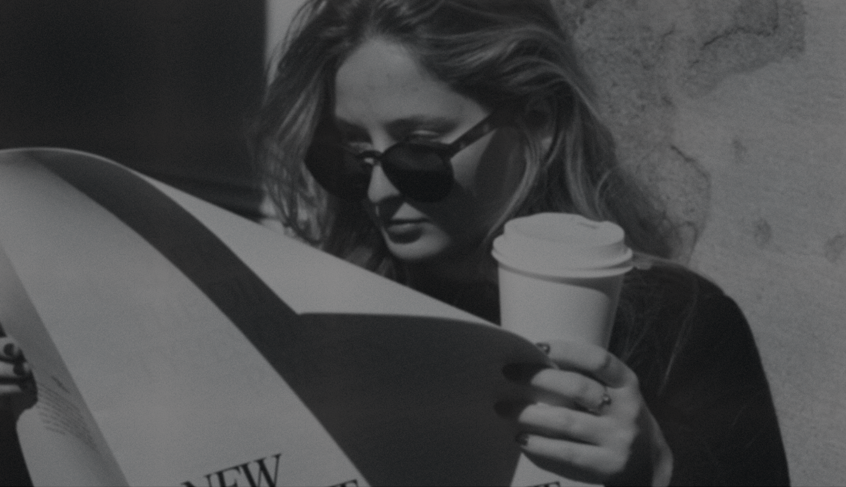 woman reading newspaper